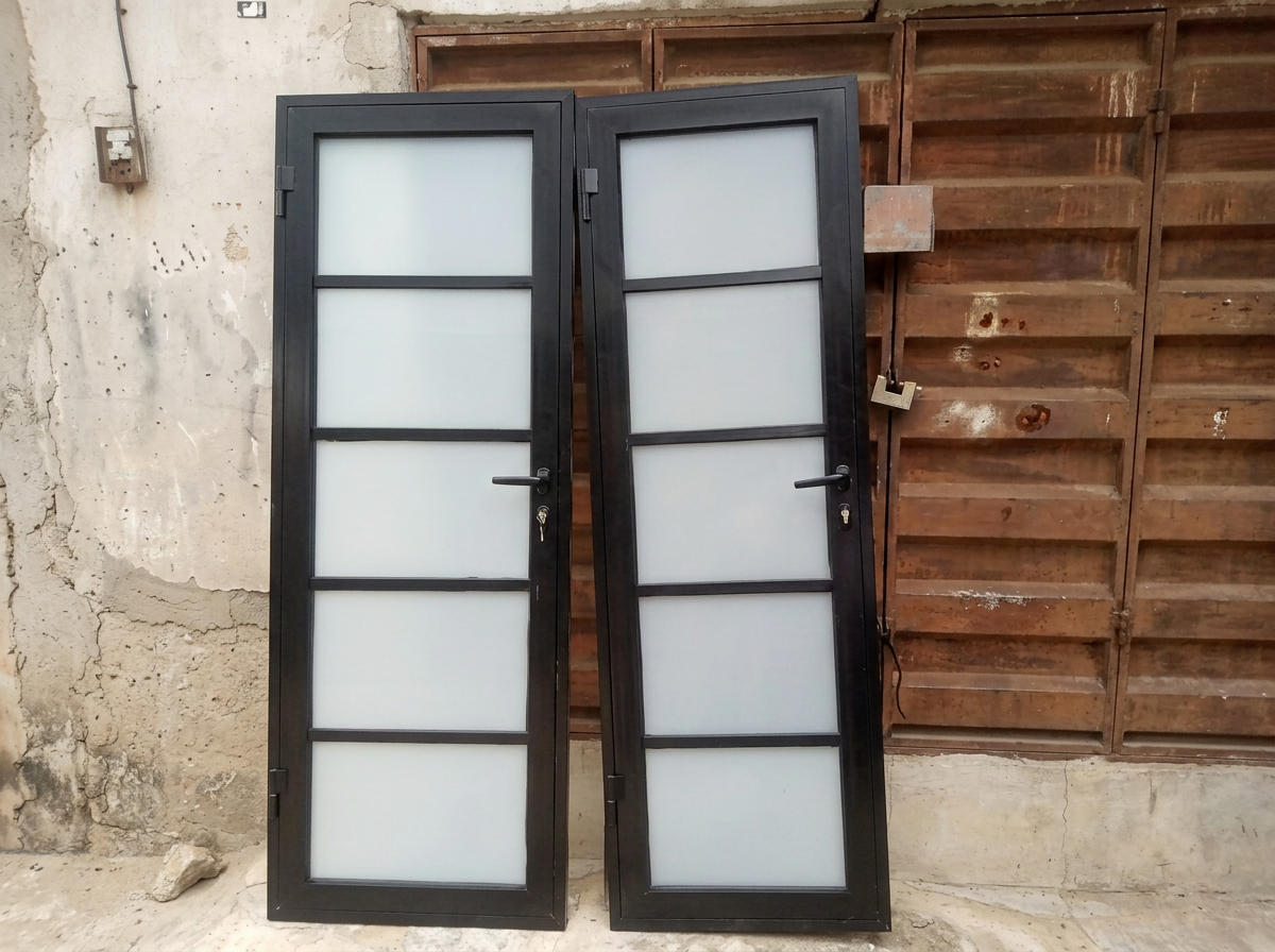 Black aluminum doors with frosted glass panels