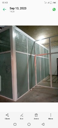 Frosted glass and aluminum office partition system